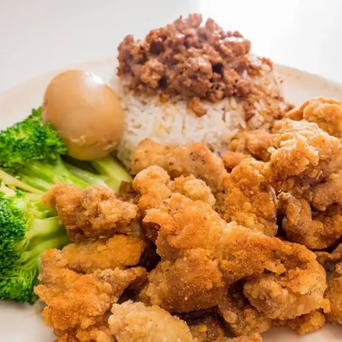 Popcorn chicken over Rice